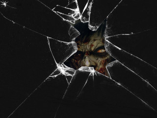 Scary face broken glass window - scary free wallpaper