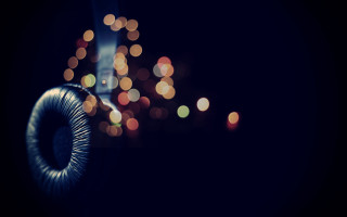 Headphone closeup blurry lights bokeh - the background and a blurry background free wallpaper