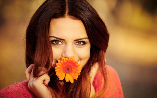 Woman smiling flower mouth holding - her nose free wallpaper
