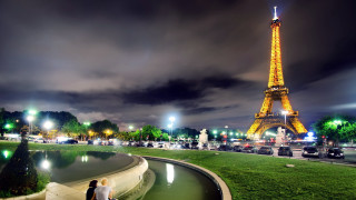 Eiffel tower night cityscape park - a couple sitting free wallpaper