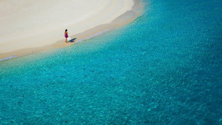 Beach water boat sand sky - the water and a boat free wallpaper