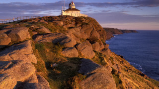 Lighthouse rocky cliff ocean sunset 6 - a rocky cliff free wallpaper