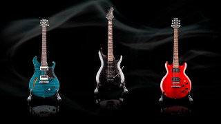 Three guitars red blue black - product photography free wallpaper