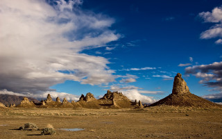 Desert landscape rocks clouds sky - a desert landscape free wallpaper