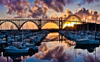 Bridge water sunset clouds boats - a bridge over a body of water free wallpaper