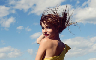 Woman yellow dress waving hair - a yellow dress free wallpaper