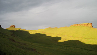 Grassy hill cloudy sky landscape - a few hill free wallpaper