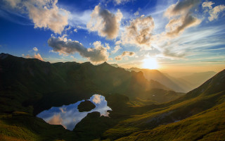 Sunset mountain lake reflection clouds - a beautiful sunset over a mountain lake free wallpaper