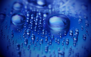 Water droplets blue surface holography - a close up of water droplets free wallpaper for desktop