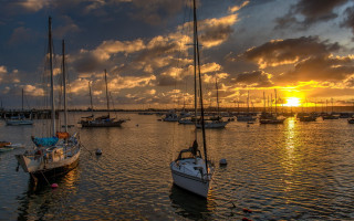 Boats water sunset clouds cityscape - top of a body free wallpaper
