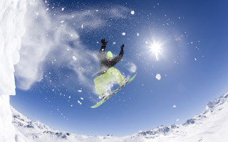 Snowboarder midair sunny winter night - a snowboarder free wallpaper