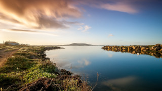 Water sky clouds island cityscape - a small island in the middle of the water free wallpaper