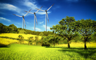 Wind turbines tree blue sky - solarpunk free wallpaper