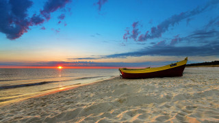 Boat sandy beach ocean sunset - a sandy beach next free wallpaper