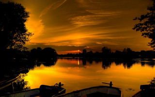 Sunset lake boats trees clouds - a sunset over a lake free wallpaper for desktop