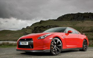 Red sports car mountain cloudy 2 - photoreal free wallpaper