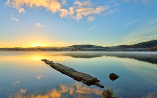 Lake sunset dock clouds rocks - a dock free wallpaper
