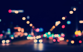 City street night blurry bokeh 2 - a blurry photo of a city street free wallpaper for desktop