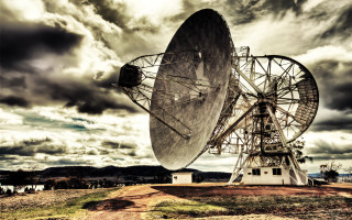 Satellite dish field cloudy sky - a dirt path free wallpaper
