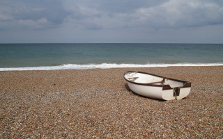 Boat beach cloudy sky ocean - the ocean in the background free wallpaper