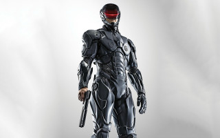 Futuristic man armor helmet gun - a futuristic suit holding free wallpaper