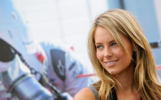 Blonde woman smiling poster background - a helmet free wallpaper