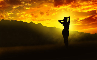 Sunset woman backlighting autumn mountain - behind her head free wallpaper