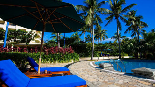 Pool lounge umbrella stone walkway - a stone walkway free wallpaper