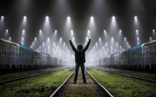 Man standing train track urban - free light wallpaper