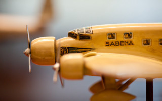 Yellow plane tiltshift shallowdepth blurry - wing and a propeller free wallpaper