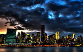 City skyline cloudy evening moon - tall free wallpaper