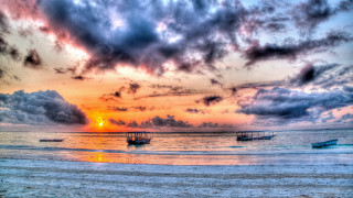 Sunset beach boats clouds pier - a sunset over a beach free wallpaper