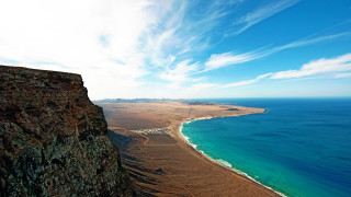Beach cliff ocean tiltshift scenery - the ocean and a cliff free wallpaper
