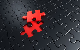 Red puzzle piece black surface - ernő rubik free wallpaper