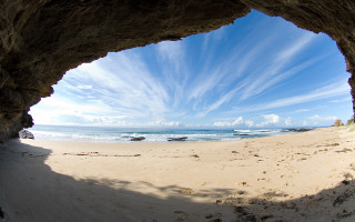 Beach view cave sunny day - wide angle len free wallpaper