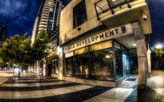 Streetcorner building trees night artdeco - modern art deco free wallpaper