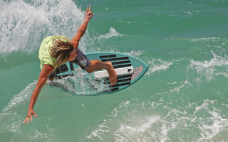 Woman surfing wave blonde swimsuit - in the ocean free wallpaper