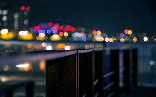 City skyline night lights fence - in the foreground free wallpaper