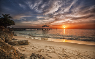 Sunset beach pier clouds dusk - a pier in the distance free wallpaper