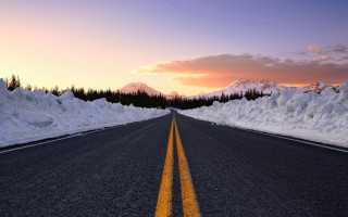 Snowy road mountain pink sky - free sunset wallpaper