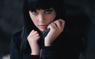 Woman black hair bangs pose - piercing eye free wallpaper