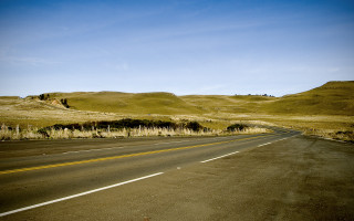 Desolate road hill blue sky 2 - a hill in the background free wallpaper