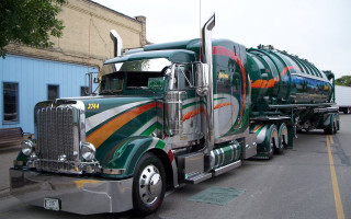 Green orange truck driving street - truck free wallpaper