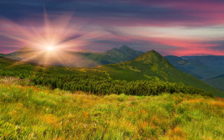 Sunset mountain range bright sunbeam - a beautiful sunset over a mountain range free wallpaper