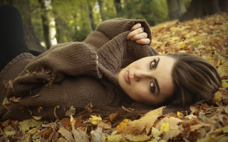 Woman lying forest autumn fishnets - the ground in a forest free wallpaper