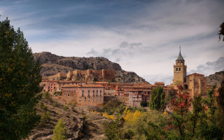 Village clocktower hillside mountains architecture - a village free wallpaper