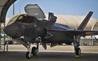 Jet fighter airport tarmac hangar - a jet fighter free wallpaper