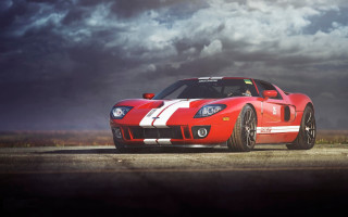 Red sports car cloudy sky 12 - a road under a cloudy sky free wallpaper for desktop