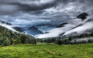 Mountain valley grassy forest clouds - a mountain valley free wallpaper