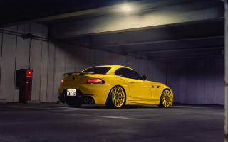 Yellow sports car parking garage 4 - the side of its free wallpaper